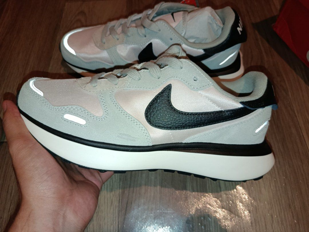 Nike Phoenix Waffle Grey/Pink Sneakers (Category: Sneakers) located in Bacolod City. Submitted by swagspot (Listing ID 1438963424, Image 1). Description: - Nike Phoenix Waffle sneakers - Color: Grey and pink - Nike swoosh: Black - Sole: White - Size: UK 9 / BR 42 / EUR 44 / US 10 - Includes original box - Reflective details on sides and heel.