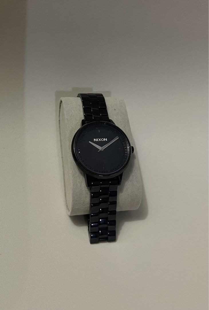Nixon The Kensington Watch (Category: Women's Watches) located in Makati City. Submitted by _ayesa (Listing ID 1438972976, Image 1). Description: - Nixon The Kensington watch - Black dial - Black stainless steel band - Round face - Water resistant up to 10 ATM - Marked with "Nixon Movin' Out The Kensington 50 M 10 ATM" on the back - no box, fits 15cm wrist circumference (ladies size), no extra links - needs battery replacement - with minimal hair