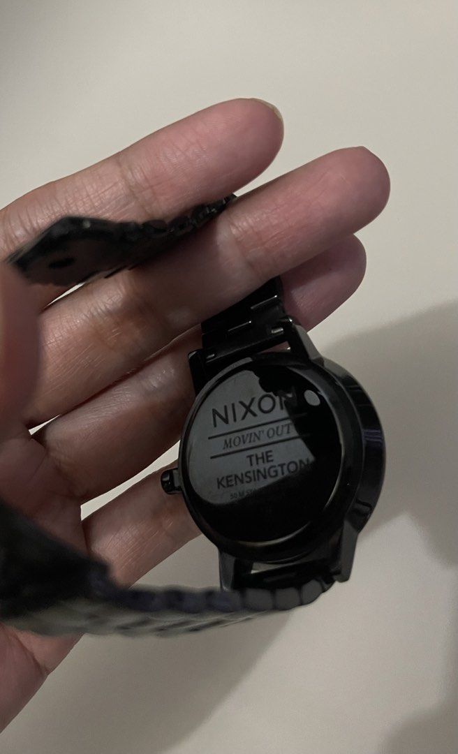 Nixon The Kensington Watch (Category: Women's Watches) located in Makati City. Submitted by _ayesa (Listing ID 1438972976, Image 2). Description: - Nixon The Kensington watch - Black dial - Black stainless steel band - Round face - Water resistant up to 10 ATM - Marked with "Nixon Movin' Out The Kensington 50 M 10 ATM" on the back - no box, fits 15cm wrist circumference (ladies size), no extra links - needs battery replacement - with minimal hair
