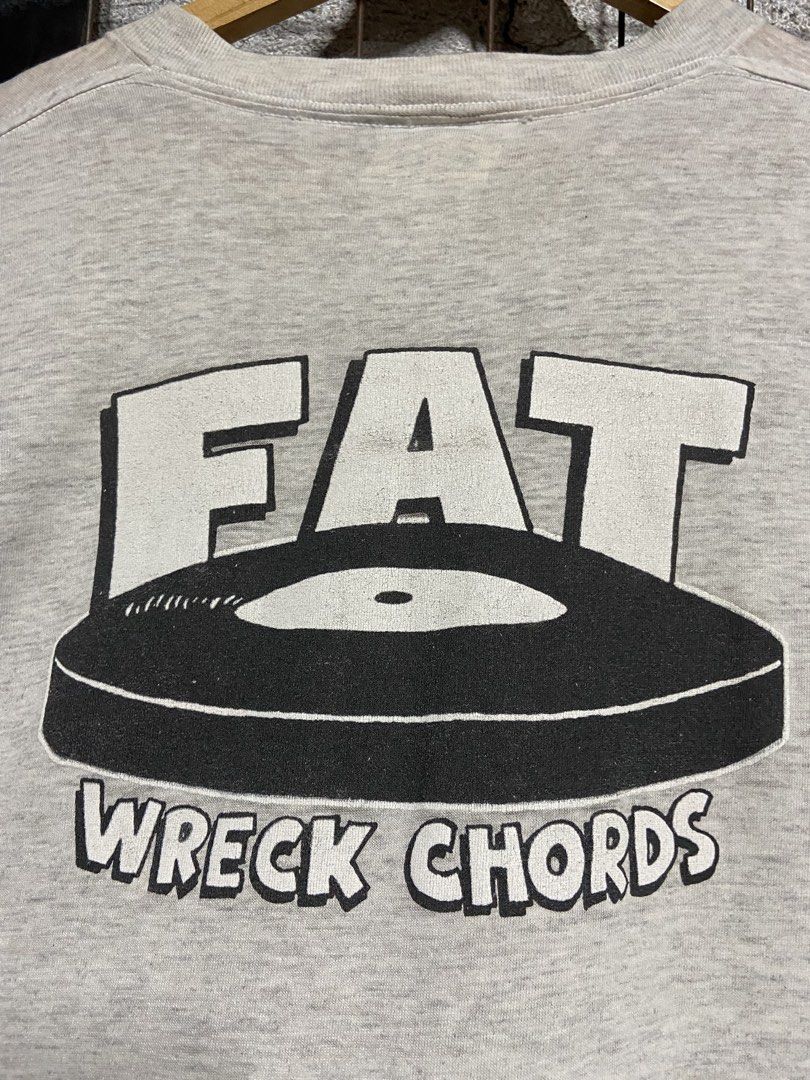 NOFX T-Shirt - 1993 Epitaph (Category: Tshirts & Polo Shirts ) located in Binan City. Submitted by doze16 (Listing ID 1439038712, Image 3). Description: - Vintage NOFX t-shirt - Features album art from "White Trash, Two Heebs and a Bean" - Gray crew neck - Fat Wreck Chords logo on the back - Epitaph label, dated 1993.