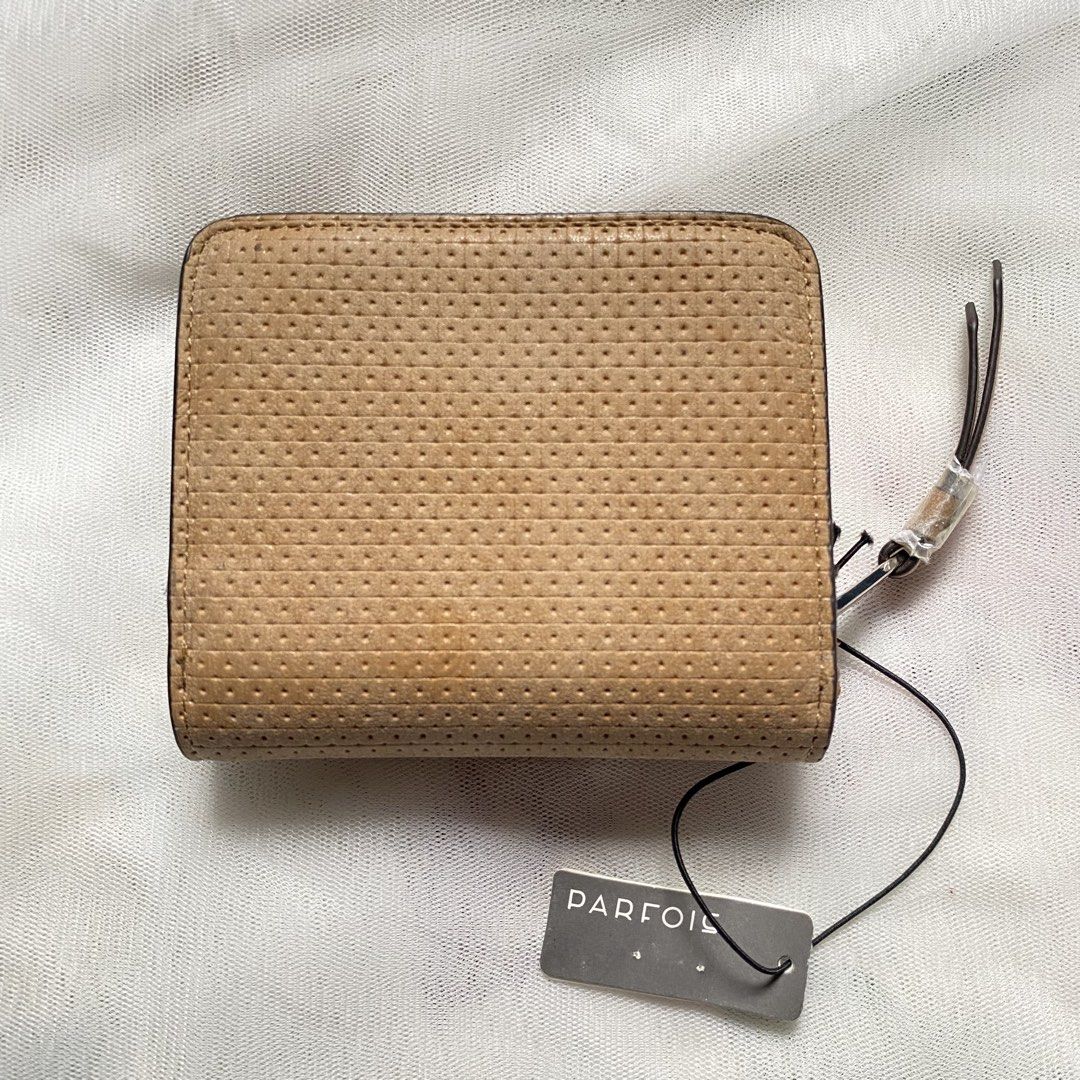 Parfois Perforated Zip Around Wallet (Category: Wallets & Card holders) located in Makati City. Submitted by imsuli (Listing ID 1438931965, Image 2). Description: ෆ Color: Tan ෆ Multiple card slots ෆ Clear ID window ෆ Coin compartment ෆ With original price tag.