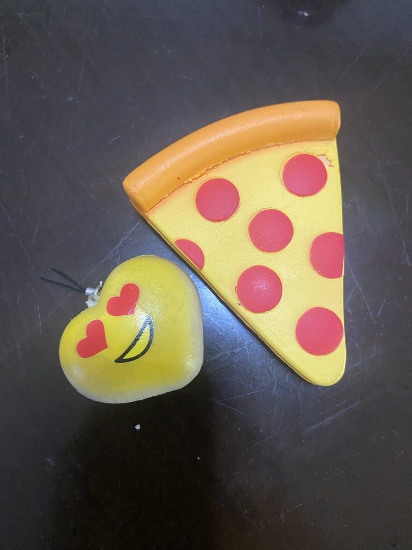 Pizza Slice and Heart Squishy Toys (Category: Kids Toys) located in Marikina City. Submitted by sansa16 (Listing ID 1438895147, Image 1). Description: - Bundle - Pizza Slice Squishy: Yellow base, red pepperoni, orange crust. - Heart Squishy: Yellow, heart eyes, smiling face. - Both are soft and squishy. - Perfect for stress relief or collecting!.