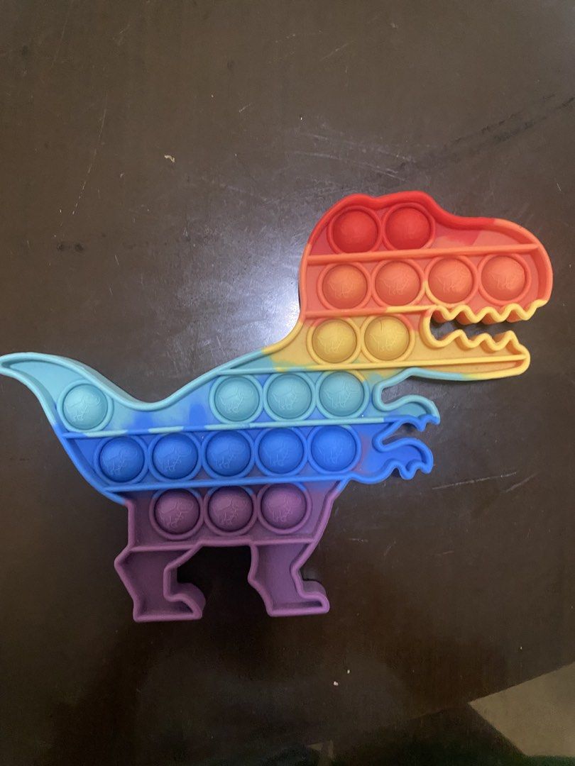 Pop It Fidget Toys - Rainbow Dinosaur and Square (Category: Kids Toys) located in Marikina City. Submitted by sansa16 (Listing ID 1438894403, Image 2). Description: - 200 Each - 350 if set.