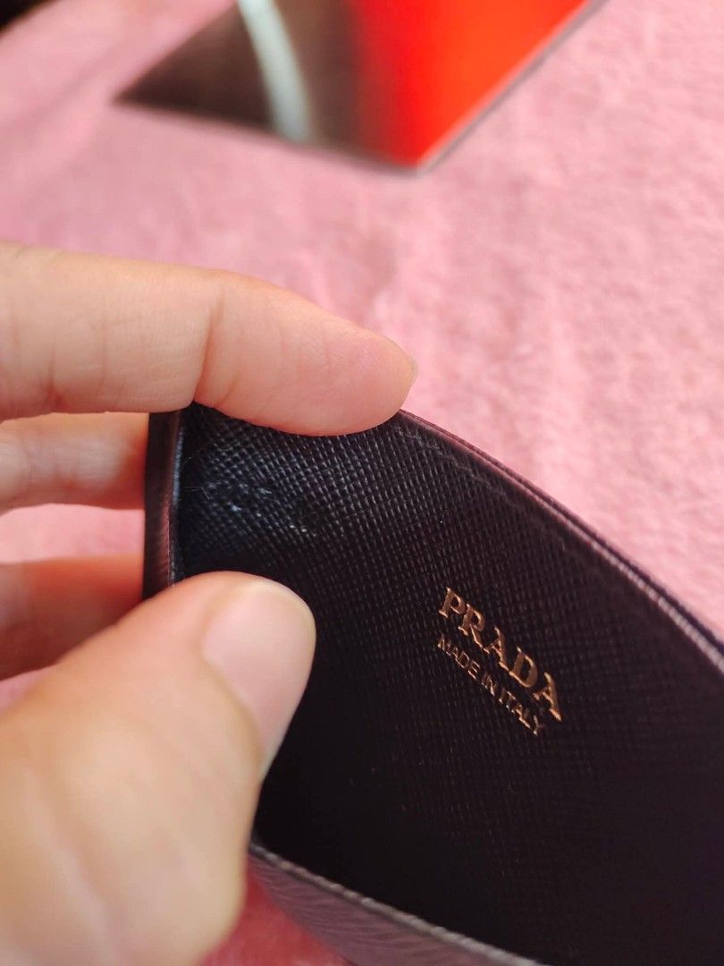 Prada Card Holder (Category: Luxury Bags & Wallets) located in Cebu City. Submitted by tlisurplus (Listing ID 1439020717, Image 2). Description: - Authentic Prada card holder - Color: Black - Features the gold Prada logo - Made in Italy - Sleek leather design - Multiple card slots.