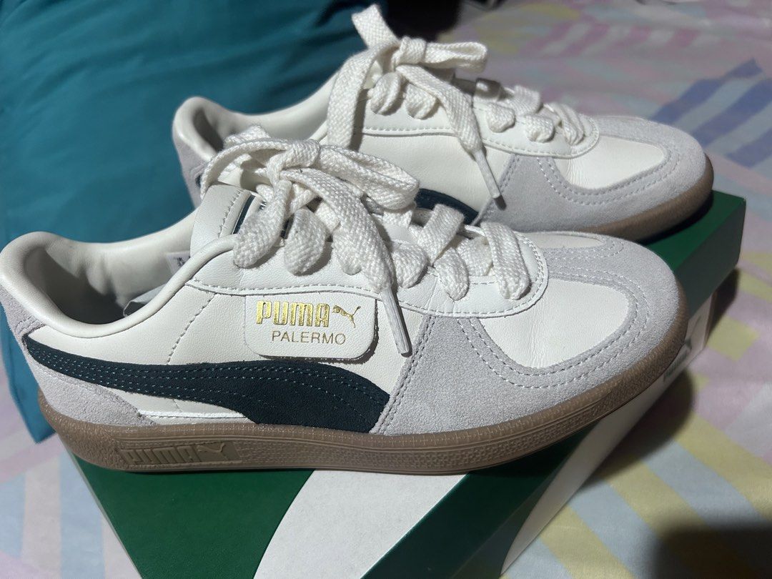 Puma Palermo Sneakers (Category: Sneakers) located in Manila. Submitted by emsmerize (Listing ID 1439025956, Image 2). Description: - Puma Palermo sneakers - Color: White, grey, and navy blue - Gum sole - Puma logo on side and heel - Includes original box - White laces - Minimal wear on sole.