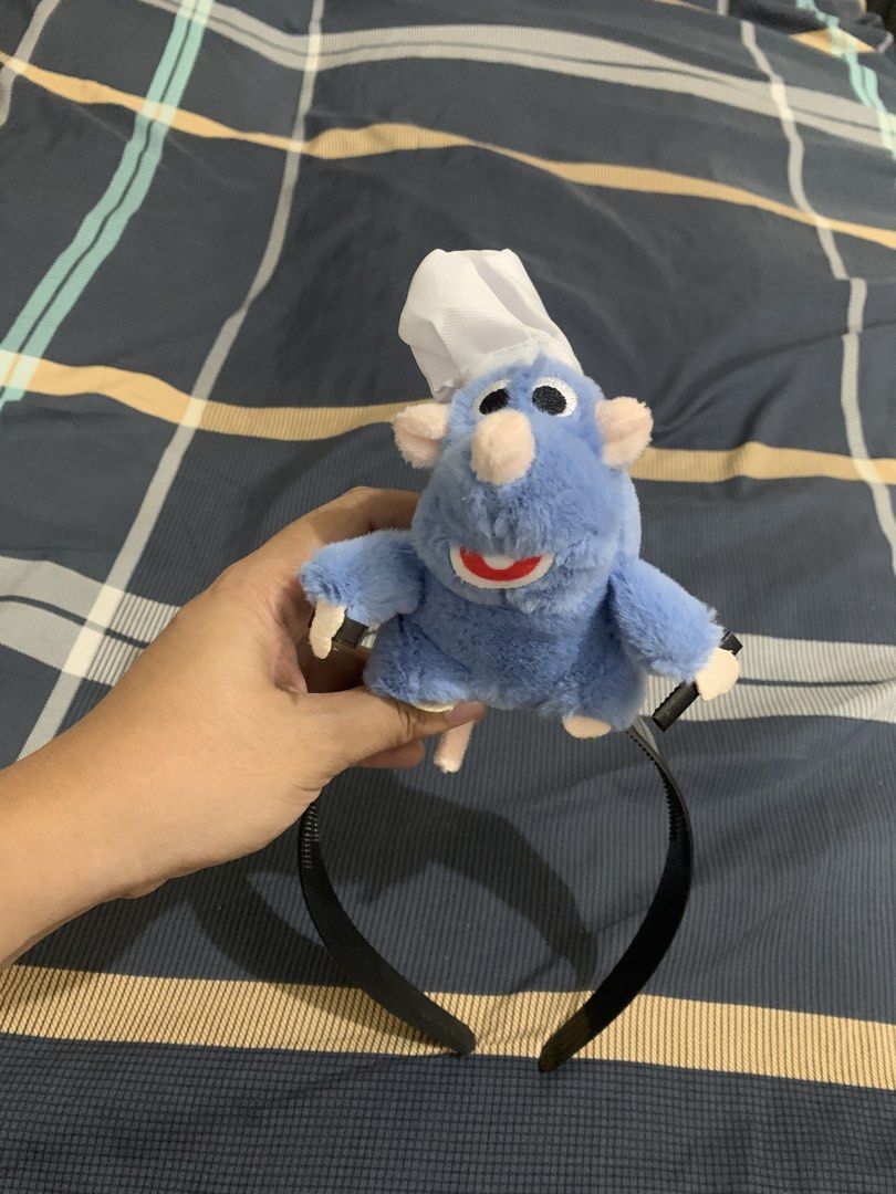 Ratatouille Remy Headband (Category: Hair Accessories) located in Quezon City. Submitted by caspii (Listing ID 1438975541, Image 2). Description: - Features a plush Remy from Ratatouille. - Remy is wearing a chef's hat. - Attached to a black headband. - Perfect for Disney fans. - Great for parties, cosplay, or everyday wear..