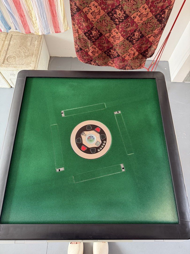 Rollercoaster Automatic Mahjong Table - Black (Category: Toys & Games) located in Singapore. Submitted by ibuyandsellshoes (Listing ID 1439066990, Image 1). Description: - Used automatic mahjong table - Features a green playing surface and black frame - Comes with a power cord - Shows some wear and tear, but fully functional - Ideal for fun game nights with friends and family -Defects as shown Fast deal self collect at my convi!.