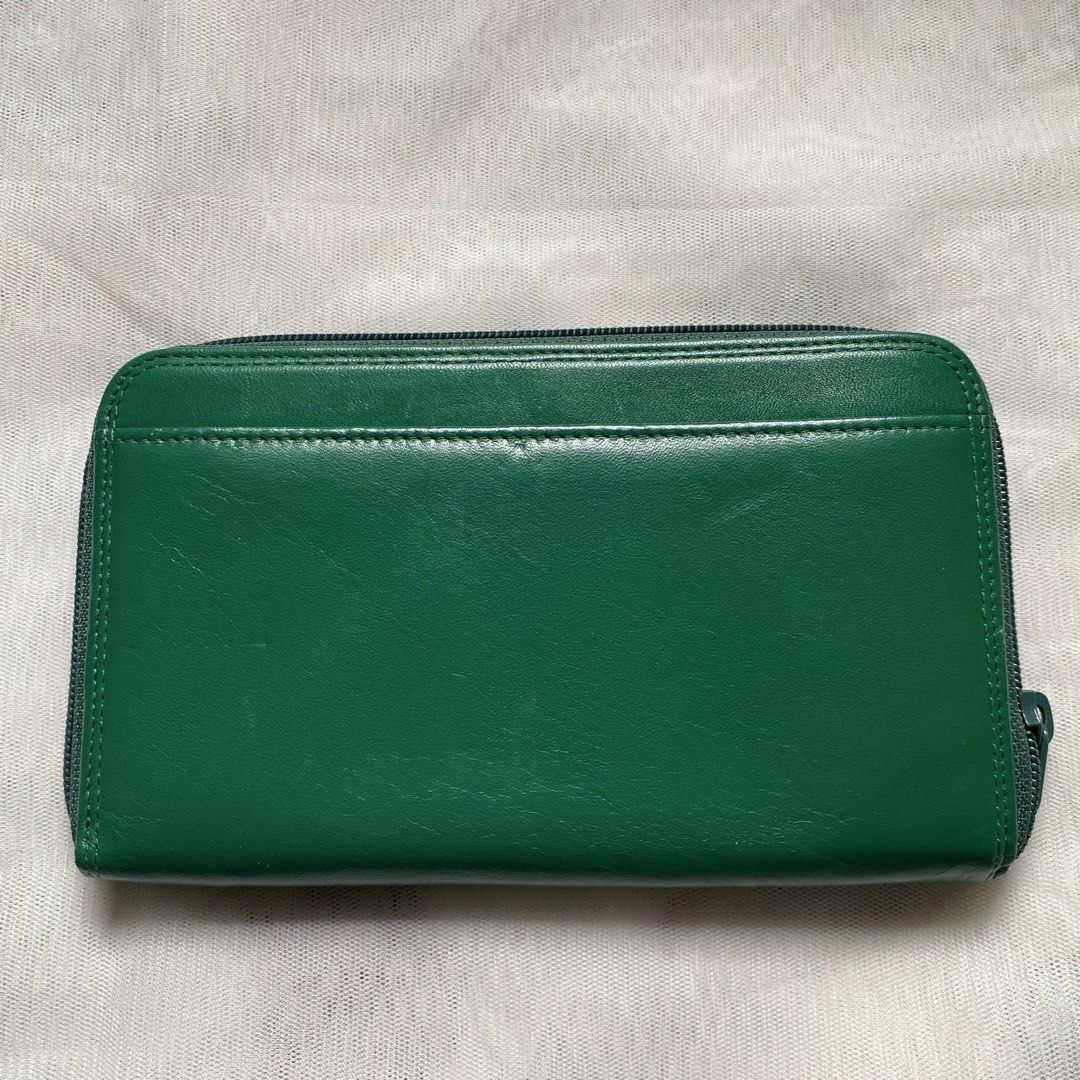 Rudolph Valentino Green Wallet (Category: Luxury Bags & Wallets) located in Makati City. Submitted by imsuli (Listing ID 1438945860, Image 2). Description: ෆ Authentic ෆ Color: Vibrant Green ෆ Features: Zip-around closure ෆ Interior: Multiple compartments, card slots, zippered coin pocket ෆ Exterior: Silver-tone brand plate.