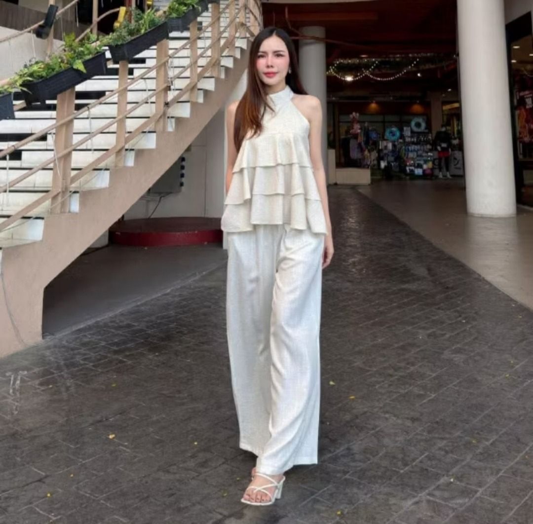 Ruffled Halter Top TIRA STUDIO (Category: Sets or Coordinates) located in Manila. Submitted by PureWonder_Shop (Listing ID 1439047180, Image 3). Description: 💛 TIRA STUDIO Color: Latte Fabric: Premium Linen (hindi makate/itchy fabric, this is premium) Fits up to 36 bust Latte color is between Cream & Brown at the 2nd photo ✨ - Halter top with layered ruffles - High neckline, sleeveless design - Ideal for casual & stylish outfit 🧁 FREE SF WITHIN