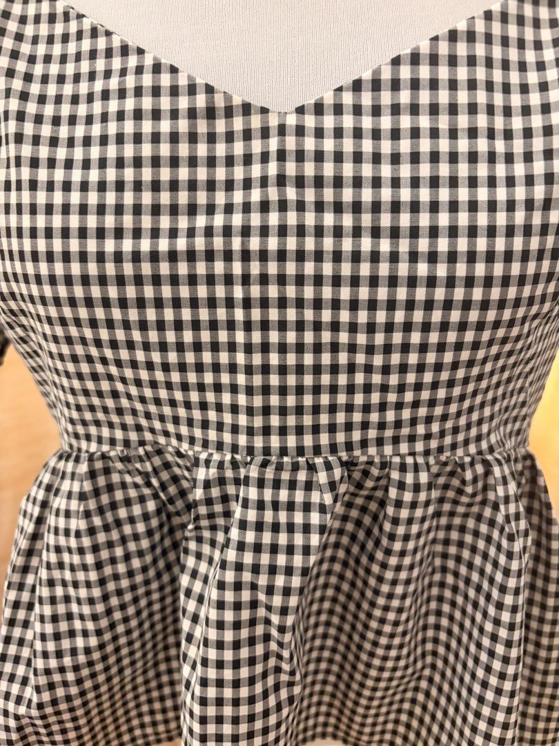 SHEIN Gingham Checkered Top with Puff Sleeves peplum (Category: Blouses) located in Quezon City. Submitted by ninas_preloved (Listing ID 1438948170, Image 2). Description: - Gingham checkered top - Sweetheart neckline - Puff sleeves - Peplum design - Lightweight fabric - Versatile for casual or dressy looks - Pairs well with jeans, skirts, or shorts.