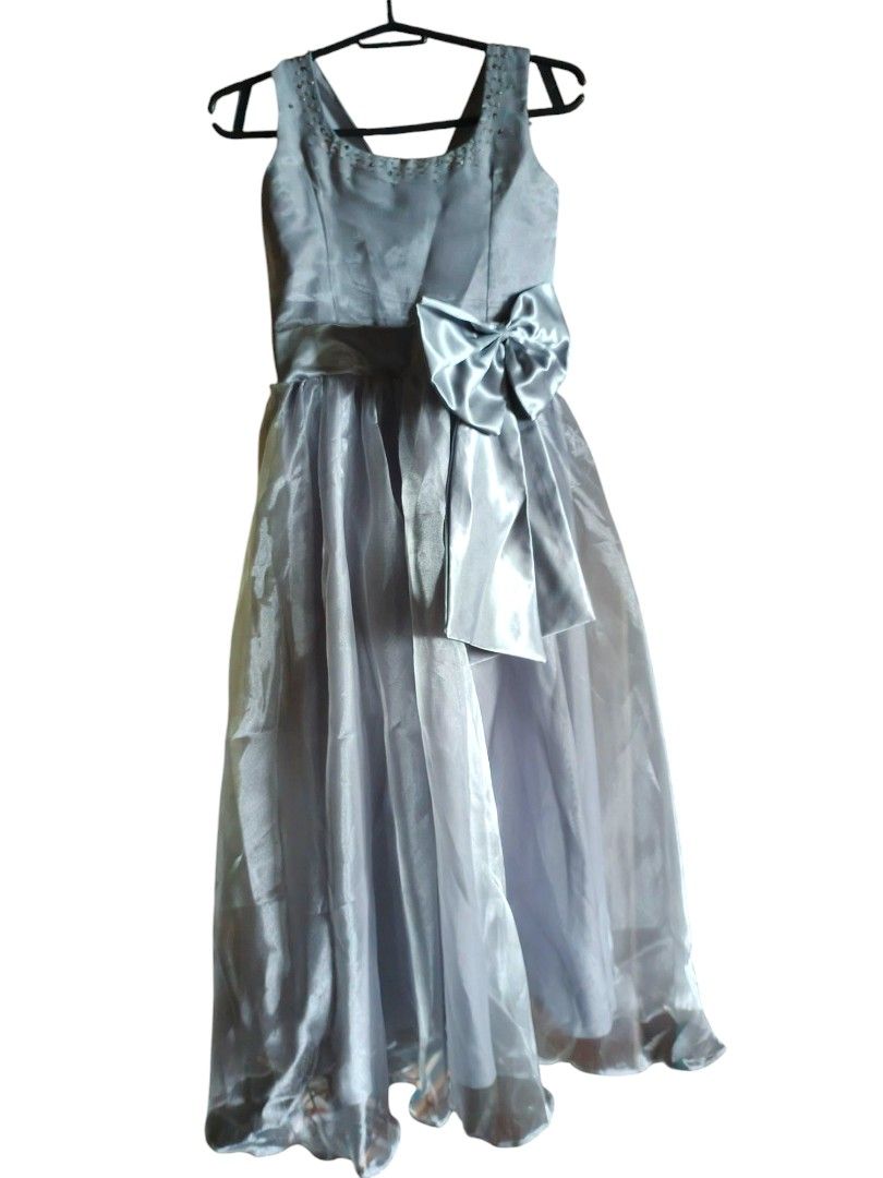Silver formal dress gown (Category: Babies & Kids Fashion) located in San Jose del Monte. Submitted by mrsmelo (Listing ID 1438956832, Image 1). Description: Hi! Just decluttering our home, my and my daughter's closet 😊 * used only once, 6th grade graduation of my daughter * really nice in real life! * this is the one from shop pe e * 13 years old * no returns/exchanges 😊🙏🏻 * g 💵 only.