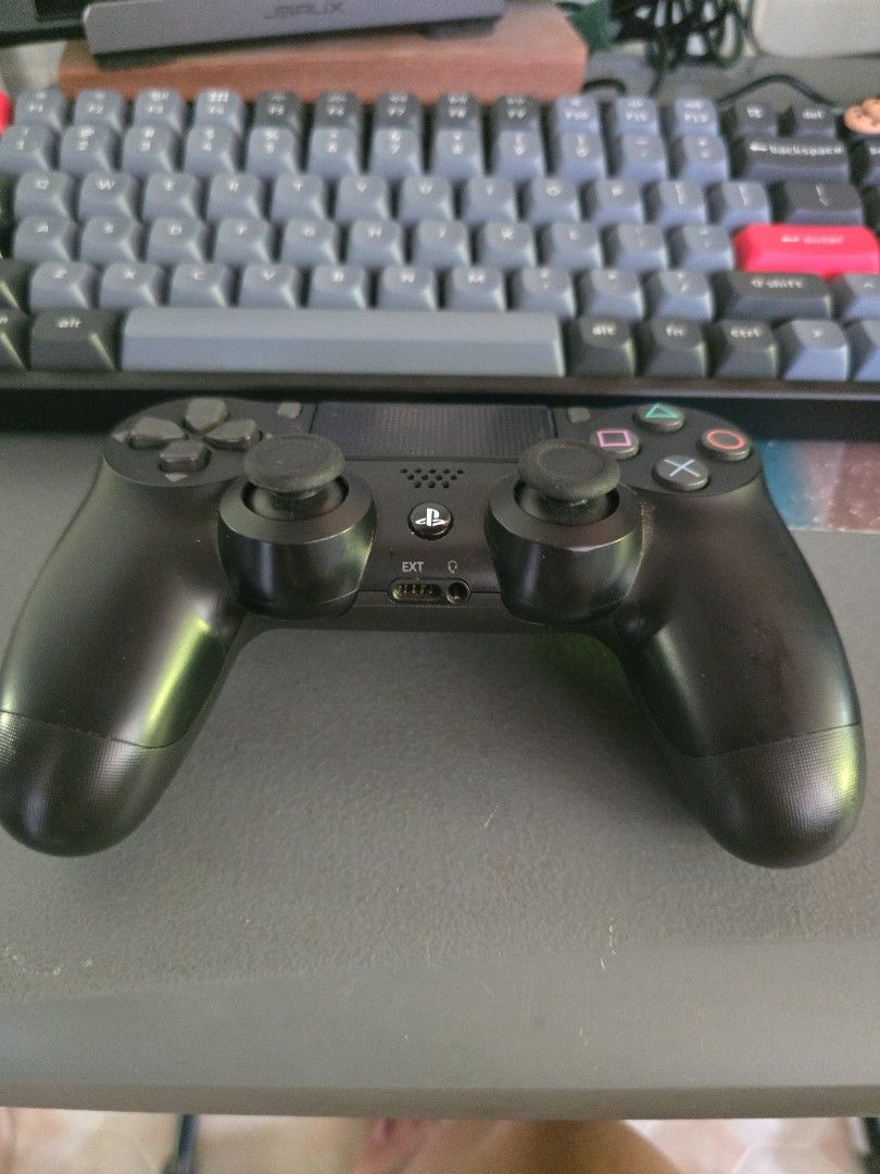 Sony PlayStation 4 DualShock 4 Controller SET (Category: Controllers) located in Infanta. Submitted by acecarrot07 (Listing ID 1438961068, Image 3). Description: - Black Sony PlayStation 4 DualShock 4 controller - Battery upgraded to 2000 mah - Includes phone clip for mobile gaming - Comes with a charging cable - Features standard button layout and touchpad - Detachable back button attachment - USB charging port - Original with factory sticker RF