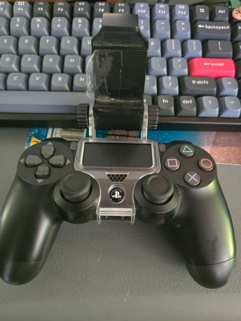 Sony PlayStation 4 DualShock 4 Controller SET (Category: Controllers) located in Infanta. Submitted by acecarrot07 (Listing ID 1438961068, Image 2). Description: - Black Sony PlayStation 4 DualShock 4 controller - Battery upgraded to 2000 mah - Includes phone clip for mobile gaming - Comes with a charging cable - Features standard button layout and touchpad - Detachable back button attachment - USB charging port - Original with factory sticker RF