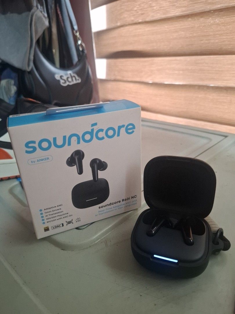 Soundcore R60i NG Earbuds (Category: Earphones) located in Manila. Submitted by oddtiger.2d0471 (Listing ID 1438900208, Image 2). Description: - Soundcore R60i NG earbuds - Includes charging case and accessories - Color: Black - Features Soundcore logo and model name on the box - Charging case included.