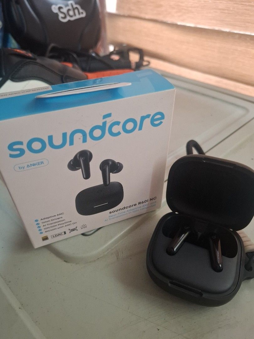 Soundcore R60i NG Earbuds (Category: Earphones) located in Manila. Submitted by oddtiger.2d0471 (Listing ID 1438900208, Image 3). Description: - Soundcore R60i NG earbuds - Includes charging case and accessories - Color: Black - Features Soundcore logo and model name on the box - Charging case included.