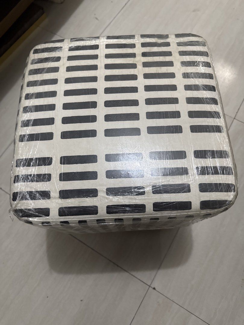 Square Footstool with Wooden Legs (Category: Chairs) located in Quezon City. Submitted by elektra0111 (Listing ID 1439000556, Image 3). Description: - Square footstool - Black and white geometric pattern - Wooden legs - Wrapped in plastic - Comfortable and functional - Perfect for resting feet or extra seating.