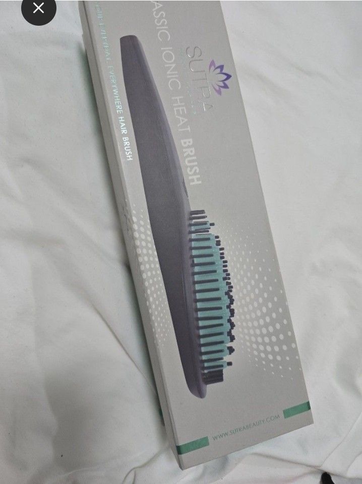 Sutra Classic Ionic Heat Brush (Category: Hair) located in Caloocan City. Submitted by mluck (Listing ID 1438986955, Image 2). Description: - Sutra Classic Ionic Heat Brush - Sleek design with turquoise brush head - Includes brush and power cord - Brand new - Box indicates 'Classic Ionic Heat Brush'.