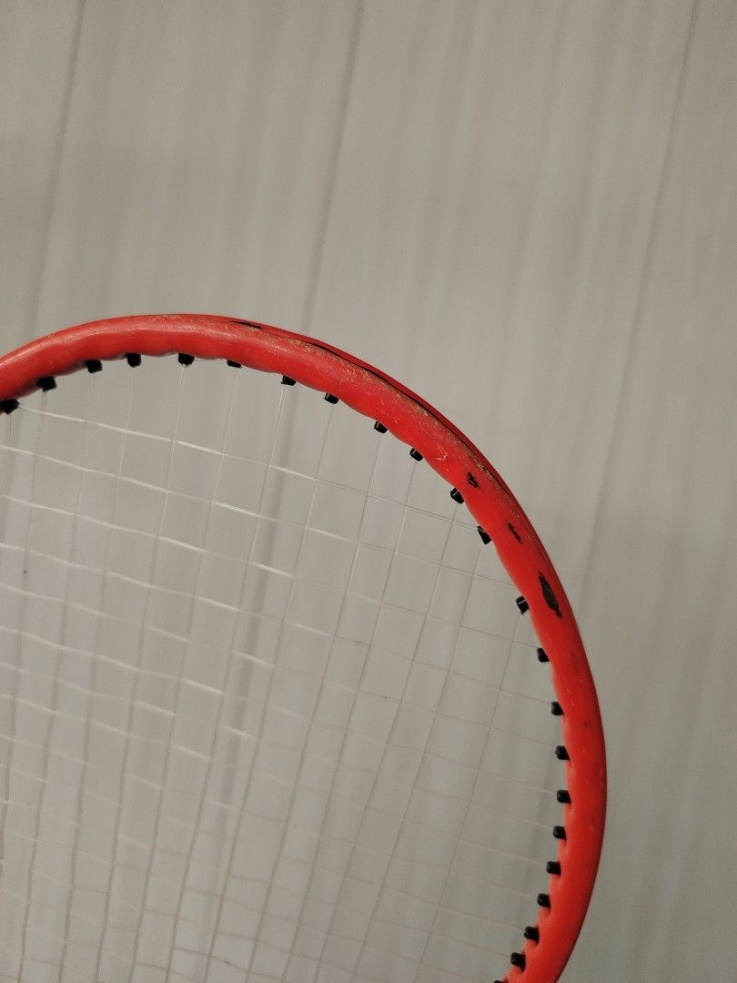 Tennis Racket for kids (Category: Racket and Ball Sports) located in Tayasan. Submitted by _raceprettyconcept (Listing ID 1438914597, Image 2). Description: - orange tennis racket with black grip - Strings are intact - Standard size - for kids - Red frame with black accents.