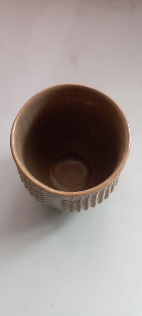 Textured Ceramic Pot (Category: Pots & Planters) located in Manila. Submitted by cool_niacene15 (Listing ID 1438967079, Image 1). Description: - Textured ceramic pot - Brown color with a lighter rim - Round shape with a wide opening - Suitable for small plants or decoration - 11 cm .