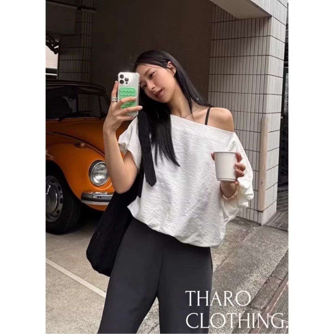 White Off-Shoulder Top (Category: Blouses) located in Caloocan City. Submitted by declutterbyA (Listing ID 1439021856, Image 2). Description: - Tharo Clothing off-shoulder top Vietnam clothing Size: Large Color: White Washed but never worn.