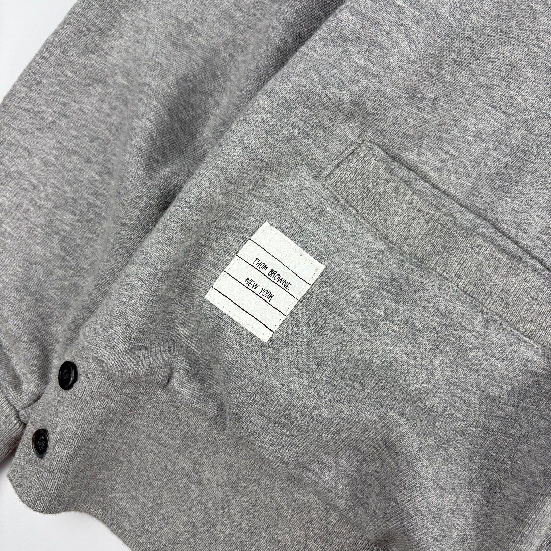 Thom Browne 4 Bar Cardigan (Category: Luxury Apparel) located in Bacolod City. Submitted by caast.archives (Listing ID 1438913638, Image 2). Description: Thom Browne 4 Bar Cardigan Size: 38 Condition: Very good Flaw: Need wash Width: 21" Length: 22".