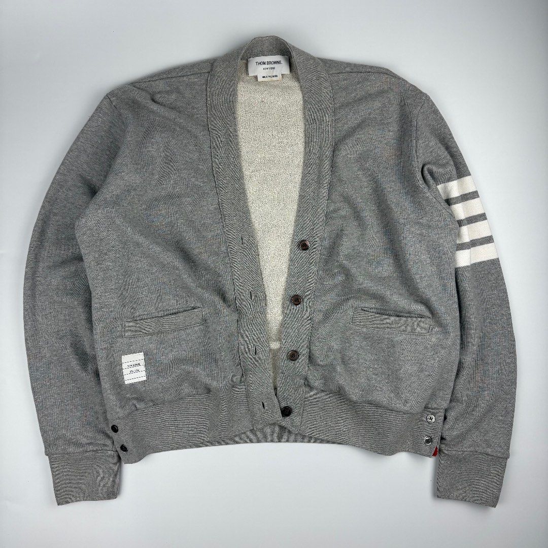 Thom Browne 4 Bar Cardigan (Category: Luxury Apparel) located in Bacolod City. Submitted by caast.archives (Listing ID 1438913638, Image 1). Description: Thom Browne 4 Bar Cardigan Size: 38 Condition: Very good Flaw: Need wash Width: 21" Length: 22".
