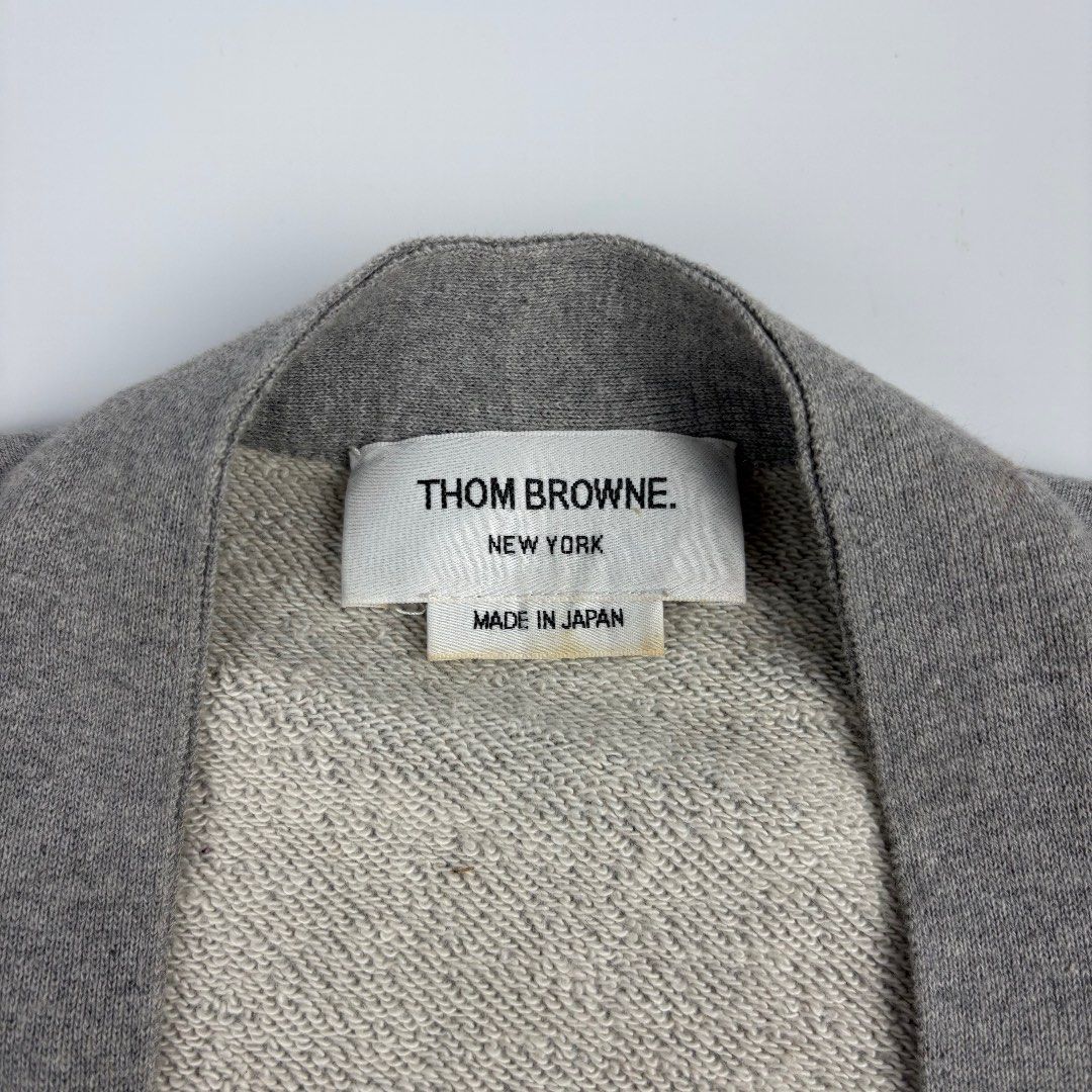 Thom Browne 4 Bar Cardigan (Category: Luxury Apparel) located in Bacolod City. Submitted by caast.archives (Listing ID 1438913638, Image 3). Description: Thom Browne 4 Bar Cardigan Size: 38 Condition: Very good Flaw: Need wash Width: 21" Length: 22".