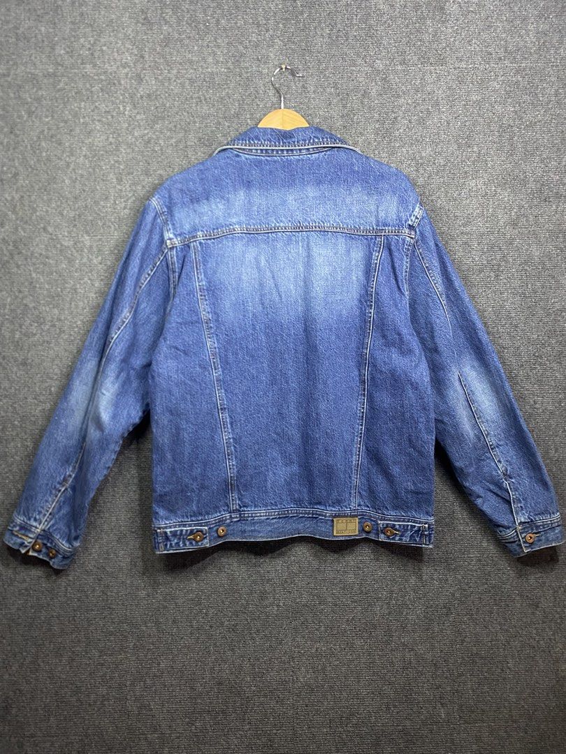 Tommy Hilfiger Plaid Denim trucker Jacket (Category: Coats, Jackets and Outerwear) located in Bolinao. Submitted by frenced28 (Listing ID 1438930170, Image 2). Description: - Authentic Tommy Hilfiger denim jacket - Size: L - Classic denim design - Button closures - Two front pockets - Plaid lining (visible at collar) - Tommy Hilfiger logo on chest pocket and inside collar.