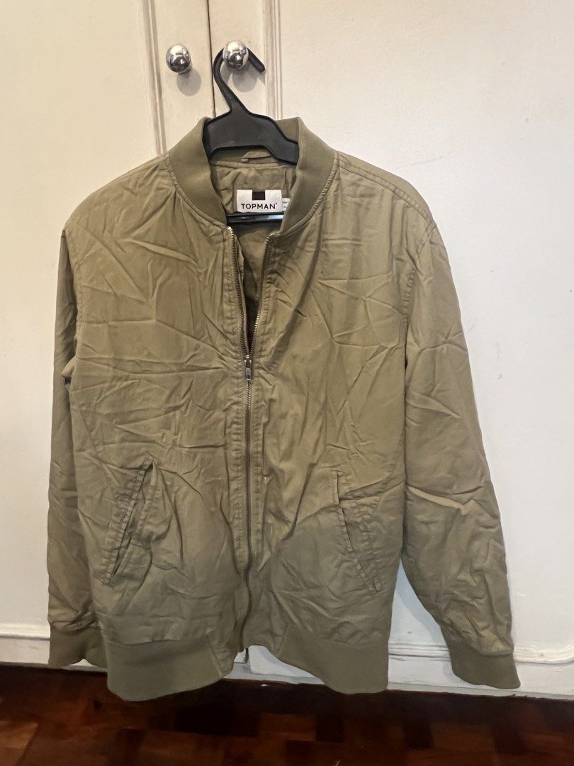 Topman Bomber Jacket (Category: Coats, Jackets and Outerwear) located in Paranaque City. Submitted by lunathehusky (Listing ID 1438922575, Image 1). Description: - Topman bomber jacket - Zip-up front - Two front pockets - Ribbed collar, cuffs, and hem - Solid color - Lightweight material - Ideal for casual wear.