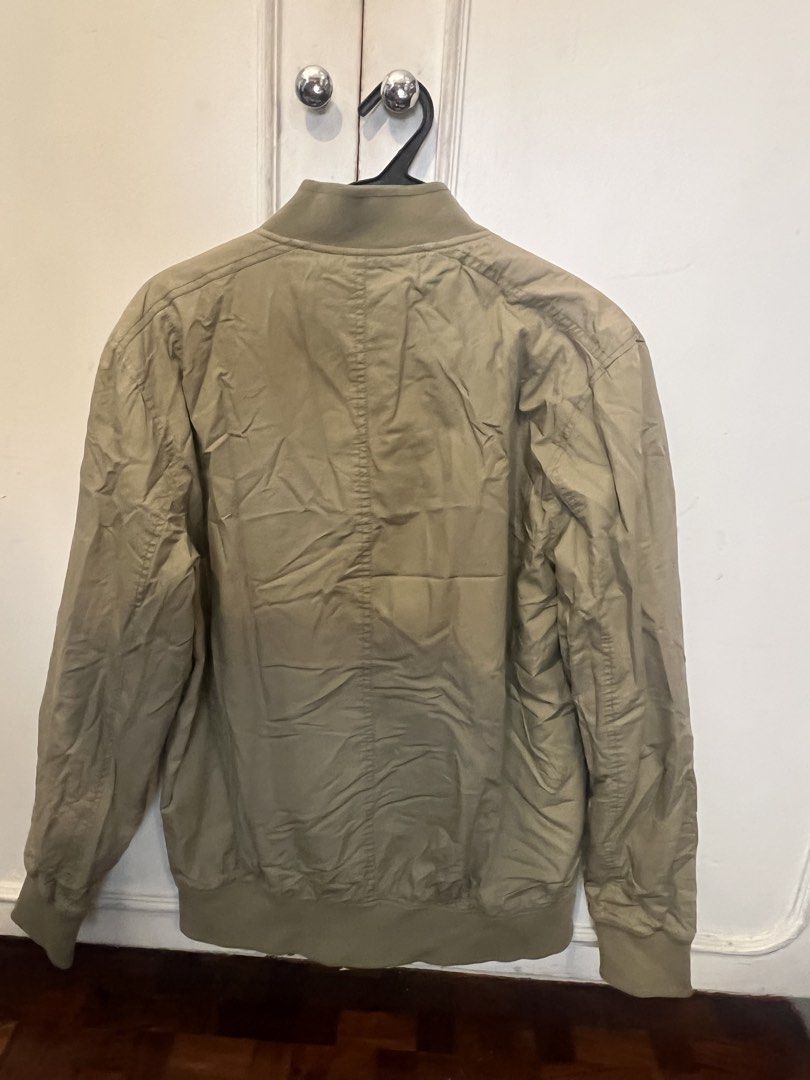 Topman Bomber Jacket (Category: Coats, Jackets and Outerwear) located in Paranaque City. Submitted by lunathehusky (Listing ID 1438922575, Image 2). Description: - Topman bomber jacket - Zip-up front - Two front pockets - Ribbed collar, cuffs, and hem - Solid color - Lightweight material - Ideal for casual wear.