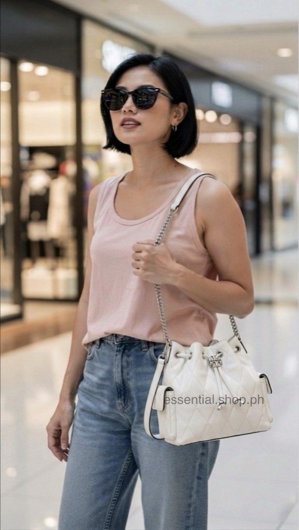 Tory Burch Charlie Quilted Drawstring Shoulder Bag in Blanco (Category: Luxury Bags & Wallets) located in Manila. Submitted by essential.shop.ph (Listing ID 1439032919, Image 2). Description: FOR PRE-ORDER! 1-2 weeks ETA AUTHENTIC with ACTUAL PICTURES POSTED Tory Burch Charlie Quilted Drawstring Shoulder Bag in Blanco Soft pebbled leather Microfiber lining Interior zip pocket 2 side pockets with magnetic closure Includes dust bag, tag and paper b