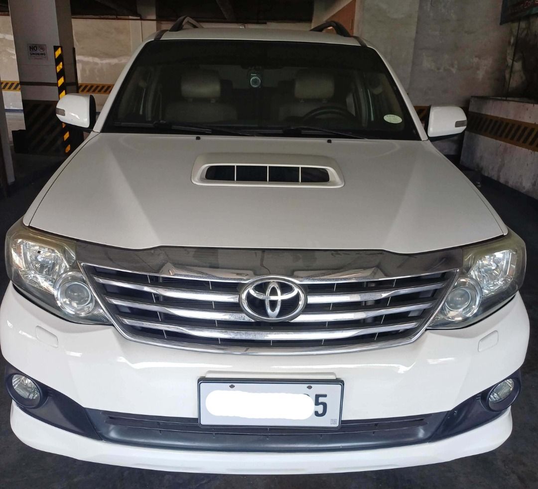 Toyota Fortuner V Auto (Category: Used Cars) located in Manila. Submitted by spawn888 (Listing ID 1439031263, Image 3). Description: 2012 Toyota Fortuner V For Sale! Ending plate is 5 SUV, Diesel, Freedom White 40K Low Mileage only automatic seat, windows top of the line Please contact me at 0922-4292167. thank you!.