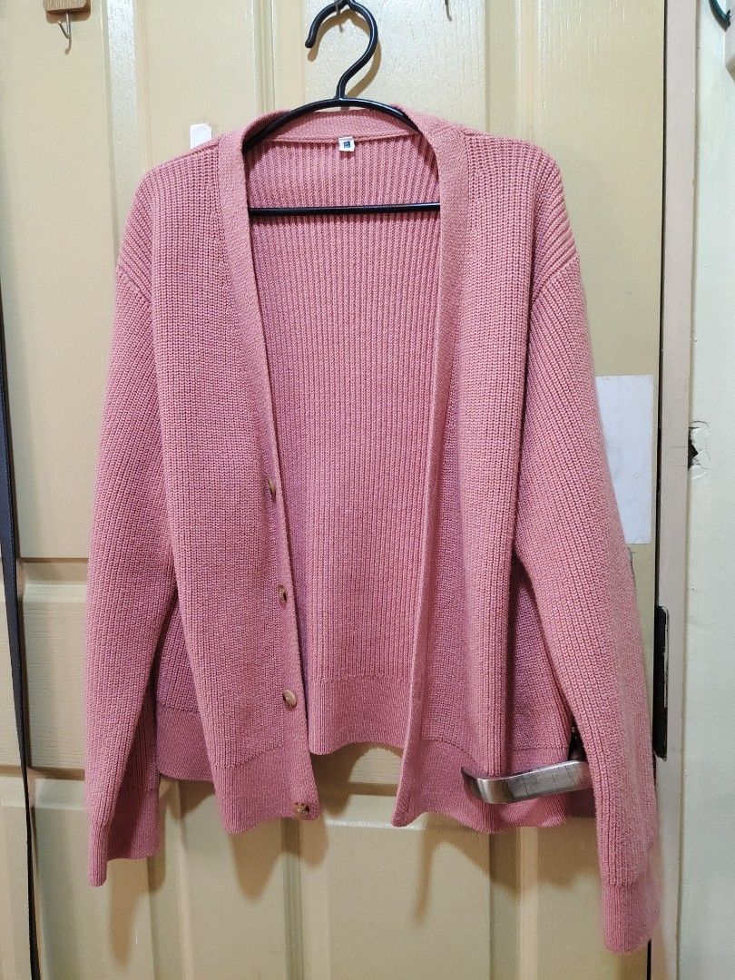 Uniqlo Pink Cardigan (Category: Coats, Jackets and Outerwear) located in Quezon City. Submitted by thelittlebookworm_ (Listing ID 1439024701, Image 1). Description: - fits small to large - Button-up style - Features two pockets - Ribbed knit texture - Classic, open design - Comfortable and versatile - Perfect for layering - Size tag visible.
