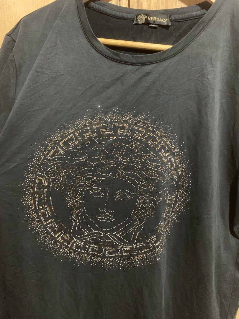 Versace Medusa Head T-shirt (Category: Tshirts & Polo Shirts ) located in Manila. Submitted by haven_thrift (Listing ID 1438924087, Image 2). Description: - Black Versace T-shirt - Features Medusa head design - Crew neck and short sleeves - Size: XXL - Soft fabric - Authentic Versace tag.