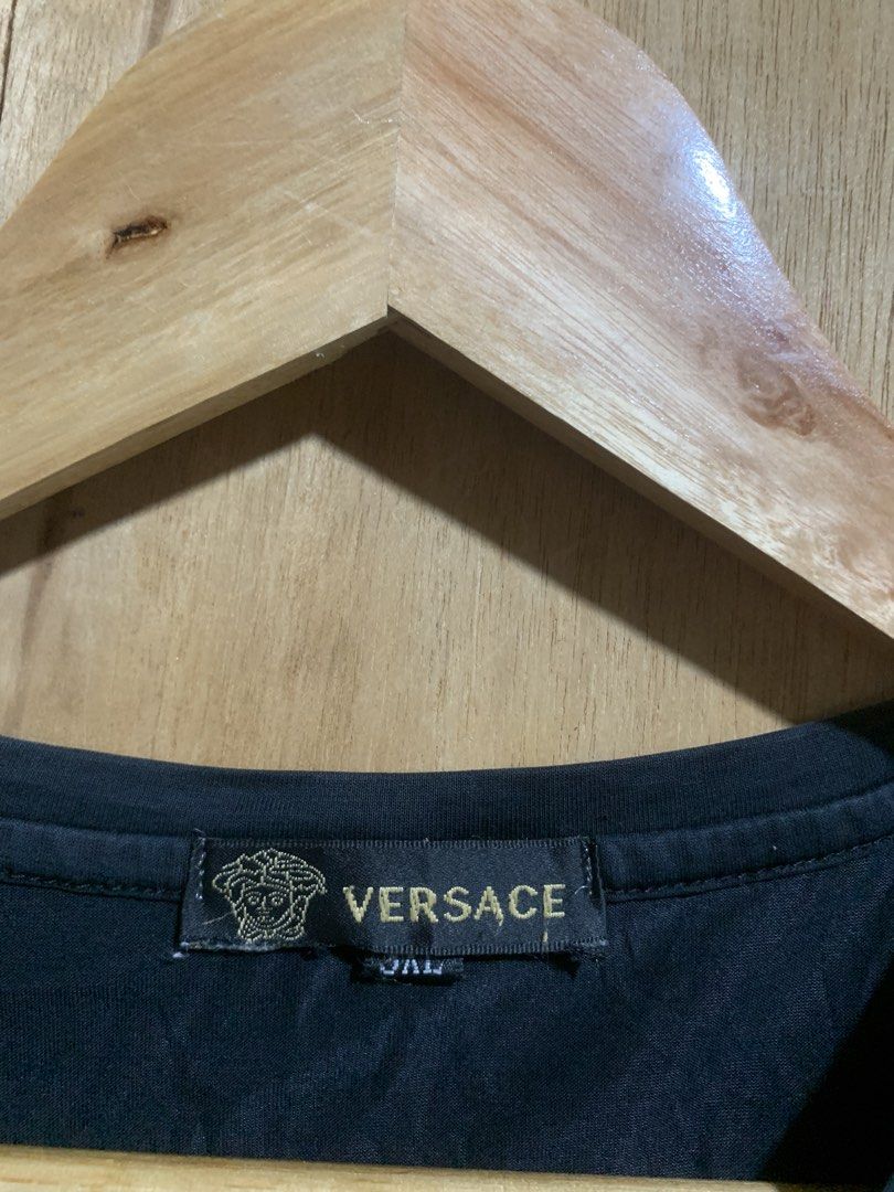 Versace Medusa Head T-shirt (Category: Tshirts & Polo Shirts ) located in Manila. Submitted by haven_thrift (Listing ID 1438924087, Image 3). Description: - Black Versace T-shirt - Features Medusa head design - Crew neck and short sleeves - Size: XXL - Soft fabric - Authentic Versace tag.