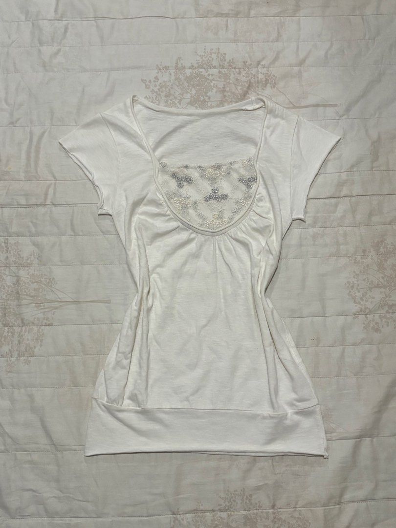 White Laced Top (Category: Blouses) located in Taguig. Submitted by everlace (Listing ID 1438997228, Image 1). Description: - White top - Scoop neckline - Short sleeves - Embellished chest - Banded hem - Soft, lightweight fabric - Versatile design.