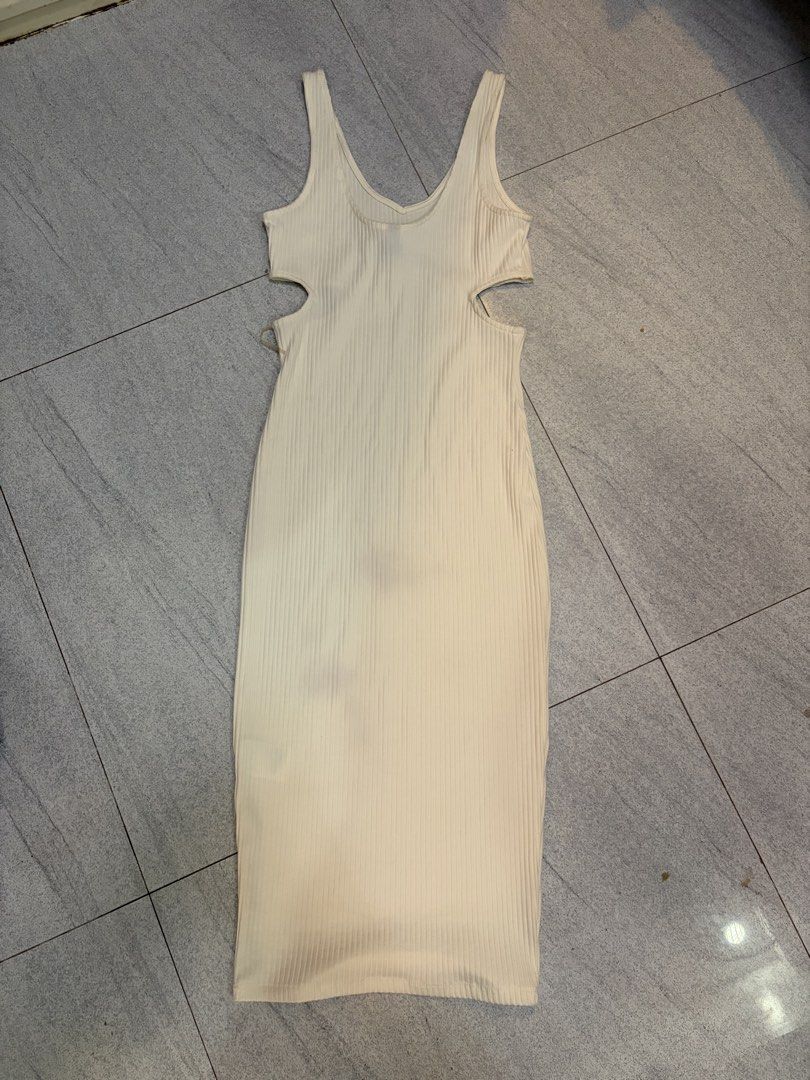 White Ribbed Cutout Midi Dress (Category: Dresses) located in Antipolo. Submitted by ffaithpreloved (Listing ID 1438907983, Image 2). Description: - SMALL - White midi dress - Ribbed texture - Cutout design - Scoop neckline - Bodycon fit - Sleeveless - Stretchy material - Suitable for casual and semi-formal occasions.