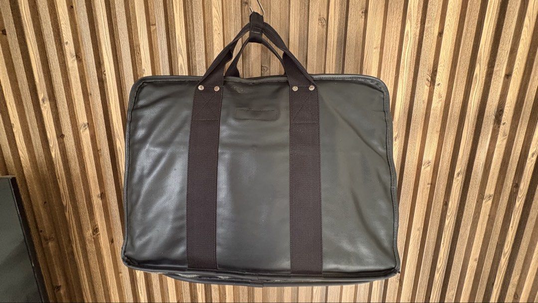 Yoshida Luggage Label Expandable Black Briefcase (Category: Briefcases) located in Dasmarinas. Submitted by 8ocho8 (Listing ID 1438900639, Image 3). Description: Yoshida Luggage Label Expandable Black Briefcase - Made in Japan - Expandable - Heavily used but still usable - Comes with the removable stiffener pad - Missing shoulder strap - All buttons/snaps and zippers are in fair condition and working - Has some scuff and hole on the edges due to 