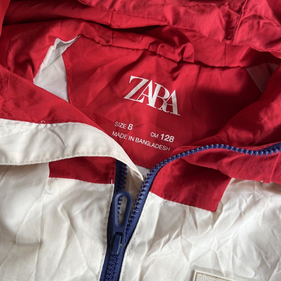 Zara Kids Colorblock Jacket Size 8 (Category: Babies & Kids Fashion) located in Dumalinao. Submitted by sweeteapie (Listing ID 1438901101, Image 2). Description: with flaws but not that visible (See attached photos) - Zara kids colorblock jacket - Features: - Red hood - White center panel - Blue sleeves - Full zipper closure - Chest patch detail - Size 8 - Made in Bangladesh - Condition: Tear on left sleeve, small paint on hoodie .
