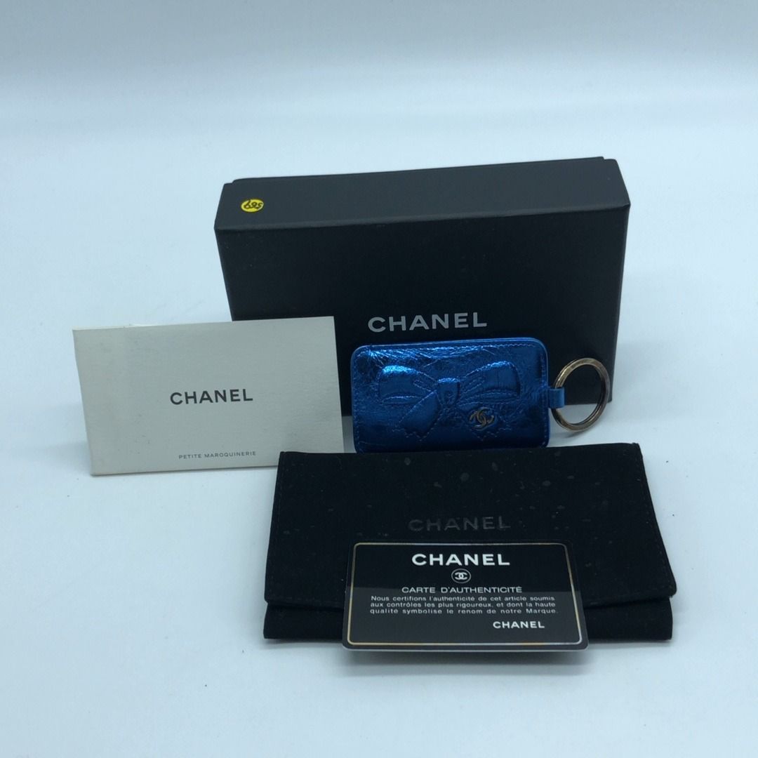 267004667 CHANEL ACCESSORY KEY CHAIN RIBBON (Category: Luxury Accessories) located in Taguig. Submitted by ecoring.ph (Listing ID 1439147578, Image 2). Description: ◆CONDITION: B ◆DESCRIPTIONS: (Other defects/info:) The body of the keychain is scratched, scuffed, has press marks, and shows signs of use. The hardware is scratched, tarnished, oxidized, and shows signs of use. ◆INCLUSIONS: Box / Dust Bag ⚠︎Please note that all sizes are approximate 