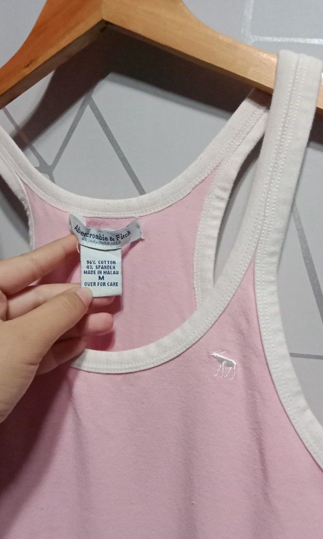 Abercrombie & Fitch tank top (Category: Others Tops) located in Tabaco. Submitted by rojean_09 (Listing ID 1439190937, Image 2). Description: Pink Abercrombie & Fitch racerback tank top with contrast white ribbed trim..