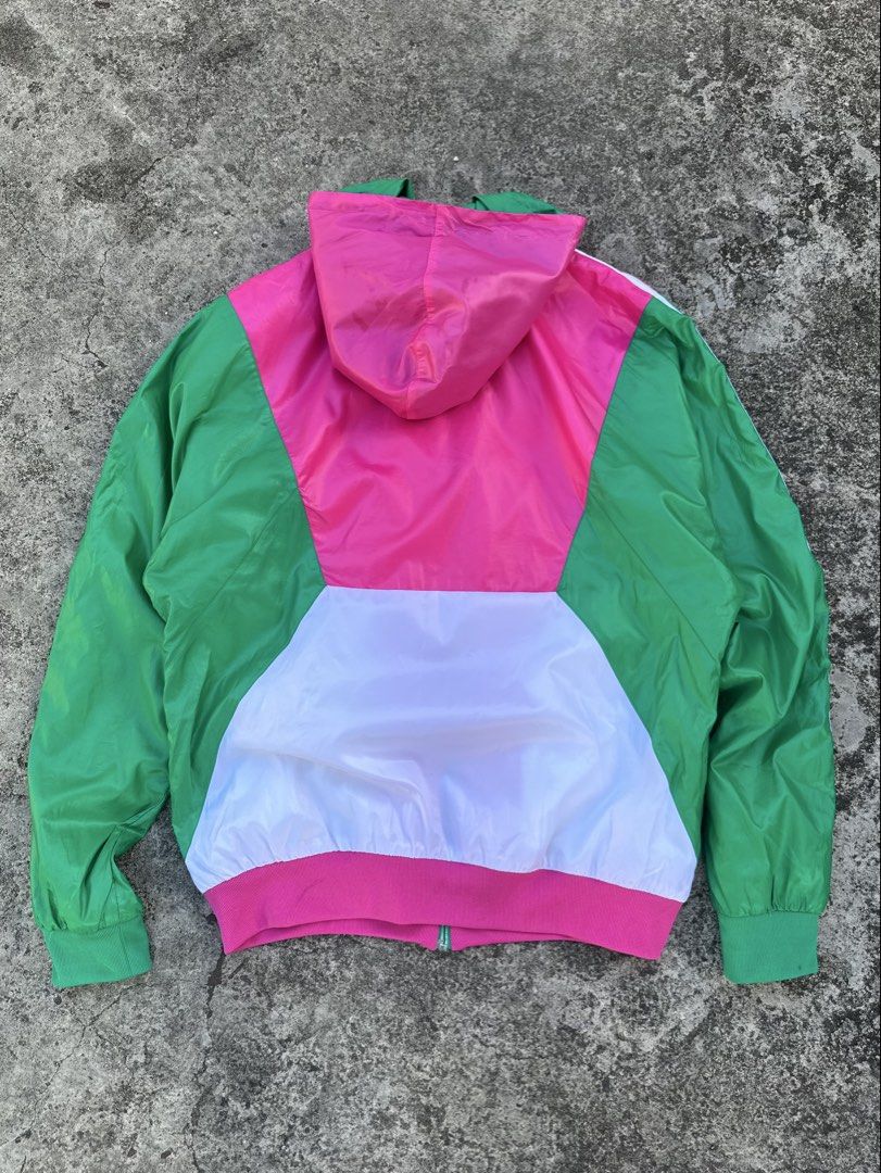 Adidas Colorblock Hooded Jacket (Category: Coats, Jackets and Outerwear) located in Daet. Submitted by thrifthings2018 (Listing ID 1439190042, Image 3). Description: - Adidas colorblock jacket - Green, pink, and white color scheme - Adidas logo on chest - Three stripes on sleeves - Zipper closure - Two front pockets - Made in Indonesia - Size L - Measurements: Width 27", Length 27", Sleeves 22".