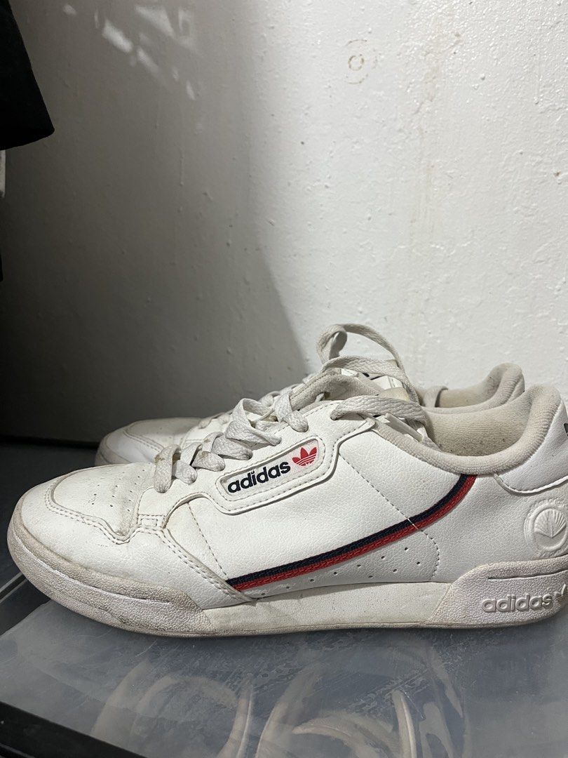 Adidas Continental 80s White Sneakers (Category: Sneakers) located in Cainta. Submitted by lmadzz (Listing ID 1439145374, Image 1). Description: - Adidas Continental 80s sneakers - Color: White - Adidas logo on tongue and side - Red and navy stripes detail - Round toe design - Lace-up closure - White soles -Used twice -needs cleaning lang.