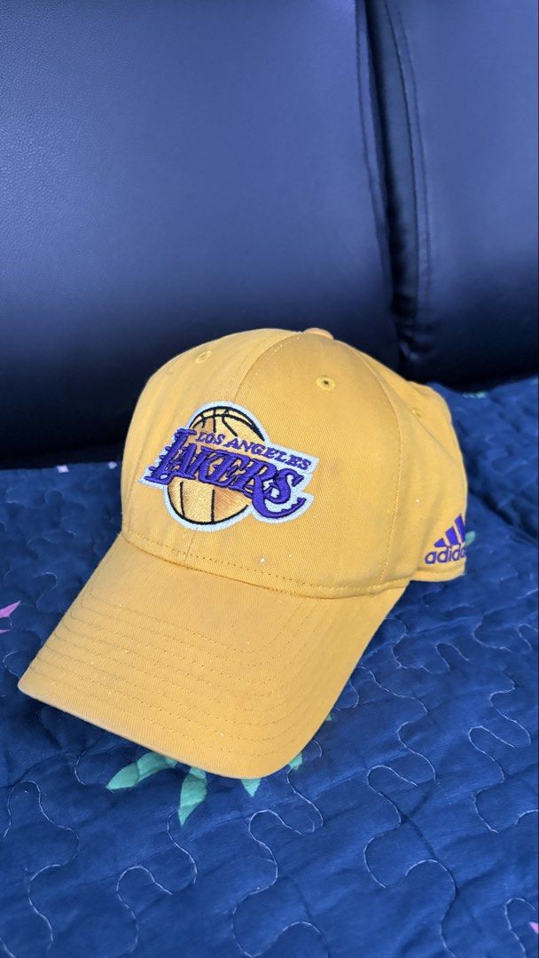 Adidas Los Angeles Lakers Cap (Category: Caps & Hats) located in Antipolo. Submitted by mmsecretshop (Listing ID 1439156150, Image 1). Description: Adidas LA Lakers Cap 7/10 condition has small white paint splatter and stain (see pics) ₱250 + Sf 📍Lower Antipolo will ship via J&T/LBC .