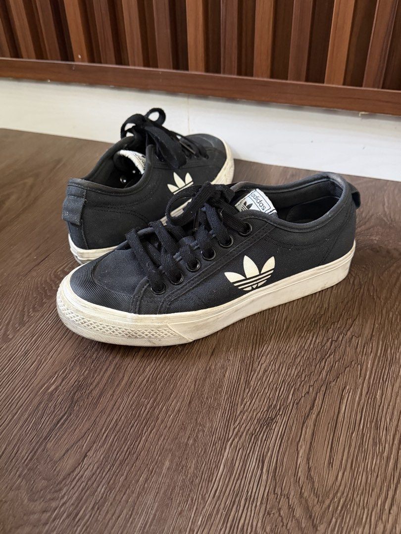 Adidas Nizza Low Black Sneakers (Category: Sneakers) located in Malabon City. Submitted by onyshandicrafts (Listing ID 1439088555, Image 1). Description: - Adidas Nizza Low sneakers - Color: Black - Size: US 5, UK 4.5, FR 37 1/3, JP 230, CHN 230 - Features Adidas logo - Made in Vietnam - Black laces, white sole - Needs cleaning.