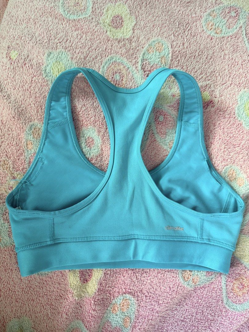 Adidas Techfit Sports Bra (Category: Activewear) located in Taguig. Submitted by che_f25 (Listing ID 1439148823, Image 2). Description: - Adidas Techfit sports bra - Vibrant blue color - Racerback style for support - Made with Climalite fabric - Adidas and G Active logos - Perfect for workouts and activities.