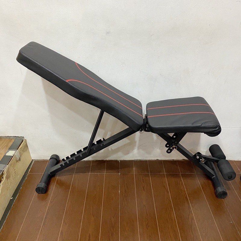 Adjustable Weight Bench (3in1) (Category: Weights & Dumbbells) located in Paranaque City. Submitted by joshsimon (Listing ID 1439193704, Image 1). Description: - Adjustable weight bench - Black seat with red accents - Sturdy black frame - Folds for easy storage - Adjustable angles for various exercises - Includes leg support.
