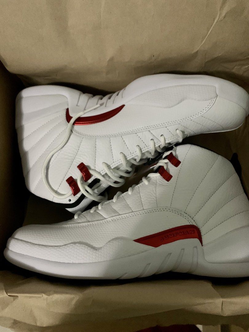 Air Jordan 12 Retro White/Red (Category: Sneakers) located in Quezon City. Submitted by jdlshop (Listing ID 1439211093, Image 2). Description: - Air Jordan 12 Retro - Color: White and Red - Condition: Unworn - Includes original box - Features Jumpman logo on box - White laces and red accents - Never been worn/ used.