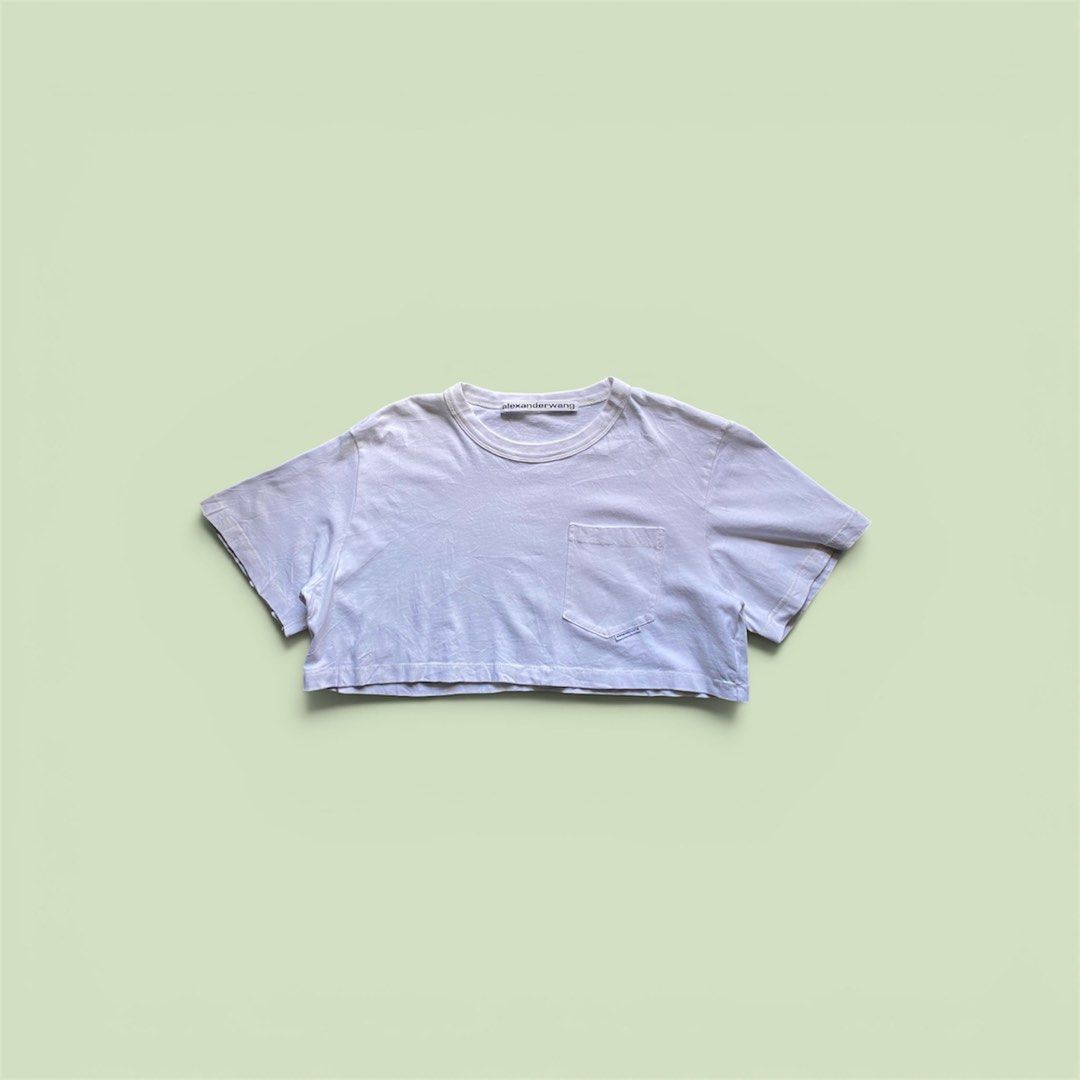 Alexander Wang Cropped White T-shirt (Category: Shirts) located in Manila. Submitted by thriftwhoop (Listing ID 1439158551, Image 1). Description: - Alexander Wang cropped t-shirt - Color: White - Features: Chest pocket, Alexander Wang logo - Made in Vietnam - Material: 100% Cotton - Neckline: Crew neck - Sleeves: Short sleeves.
