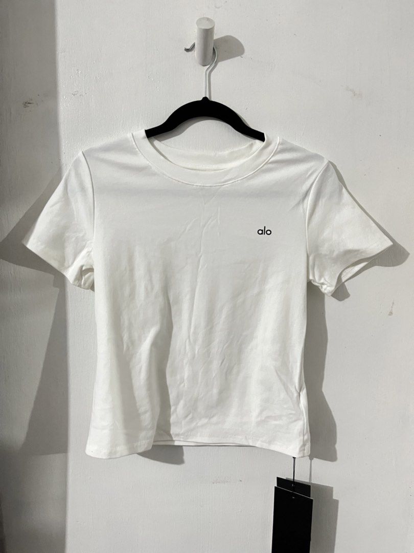 Alo White Crew Neck T-shirt (Category: Shirts) located in Quezon City. Submitted by g.ysabel (Listing ID 1439236445, Image 1). Description: - Alo overrun crew neck t-shirt - Short sleeves - Super soft material - Brand new with tag attached.